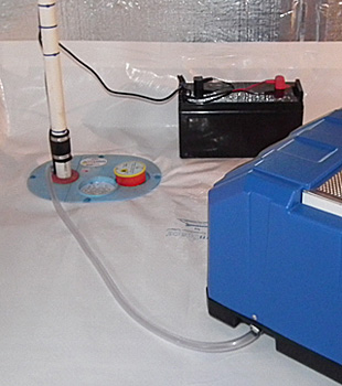 Closeup of a crawl space sump pump installed in Brantford