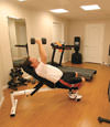 a basement gym and workout room with a wood laminate flooring, installed in St Catharines, ON