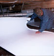 Cambridge insulation being installed in a crawl space.
