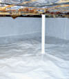 A sealed crawl space in Cambridge with a vapor barrier