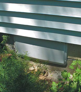 A gray crawl space vent cover in Grimsby