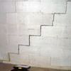 A diagonal stair step crack along the foundation wall of a Ancaster home