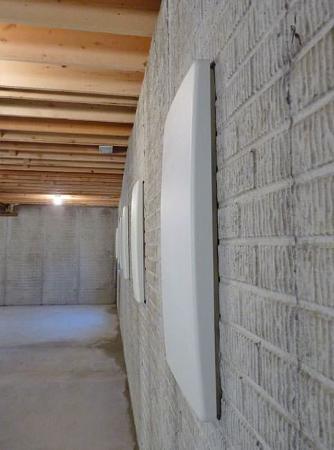 Dunnville wall anchor covers viewed from the side to show how narrow they are.