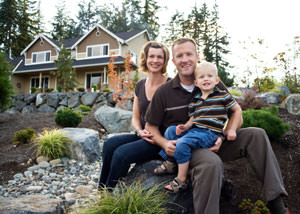 A happy family outside a home with a repaired foundation in Fergus