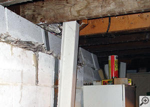 A failing foundation wall and i-beam support in a Hamilton home