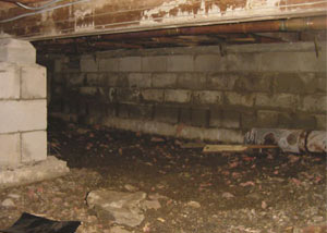 Rotting, decaying crawl space wood damaged over time in Fergus