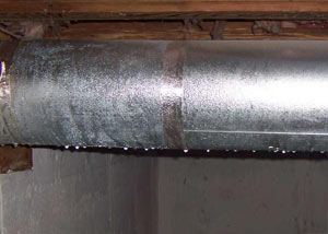condensation collecting on an HVAC vent in a humid Stoney Creek basement