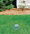 A buried gutter drain downspout extension installed in a Acton home