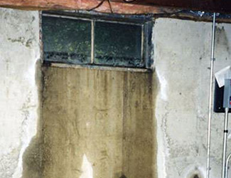 Water pouring out from a basement window in St Catharines