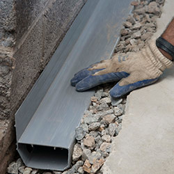 installing a drain tile system in a Tillsonburg home